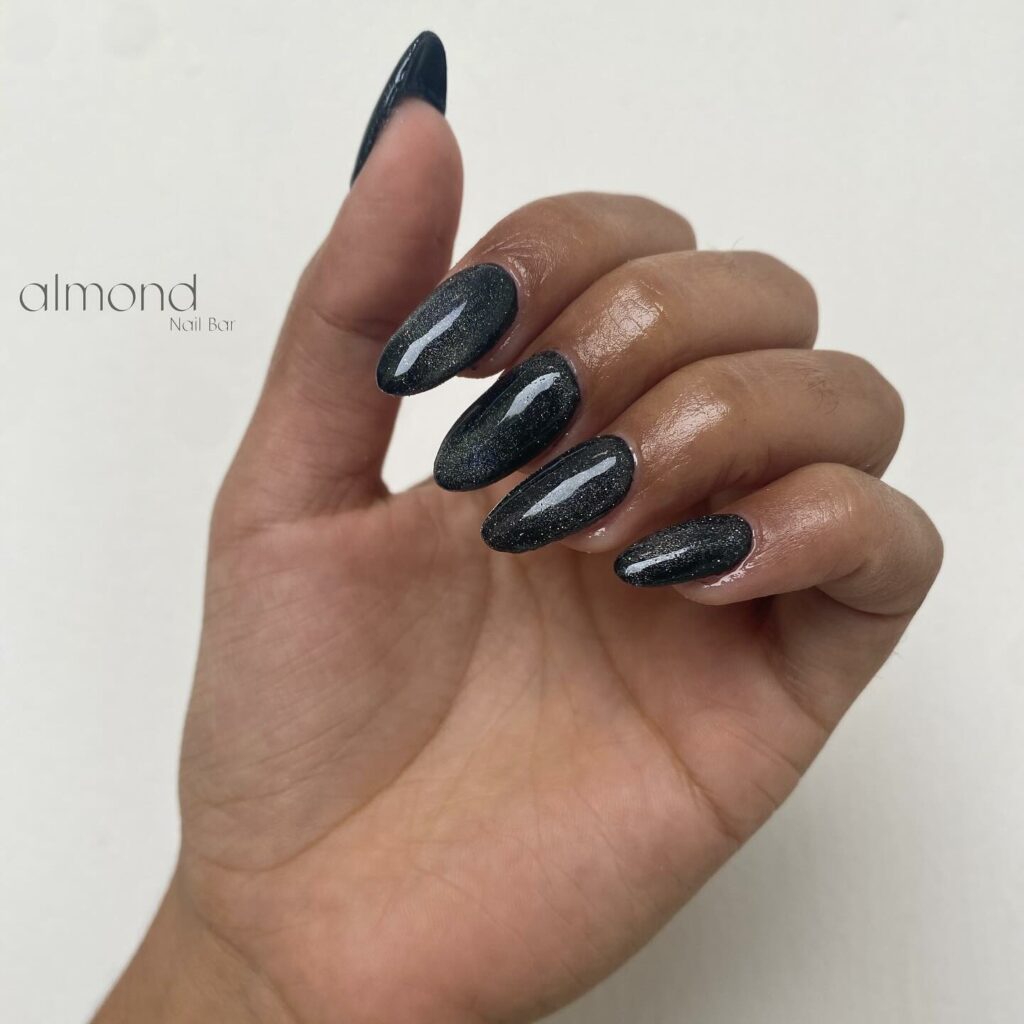 Mysterious Sheen of Cat Eye Black Almond Nails
