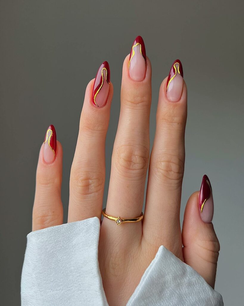 French Red Nails with Golden Swirl Accents
