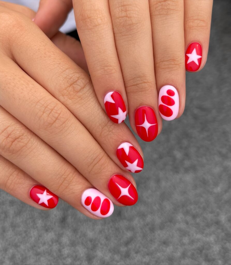 Funky Pink and Red Nails with Star Accents