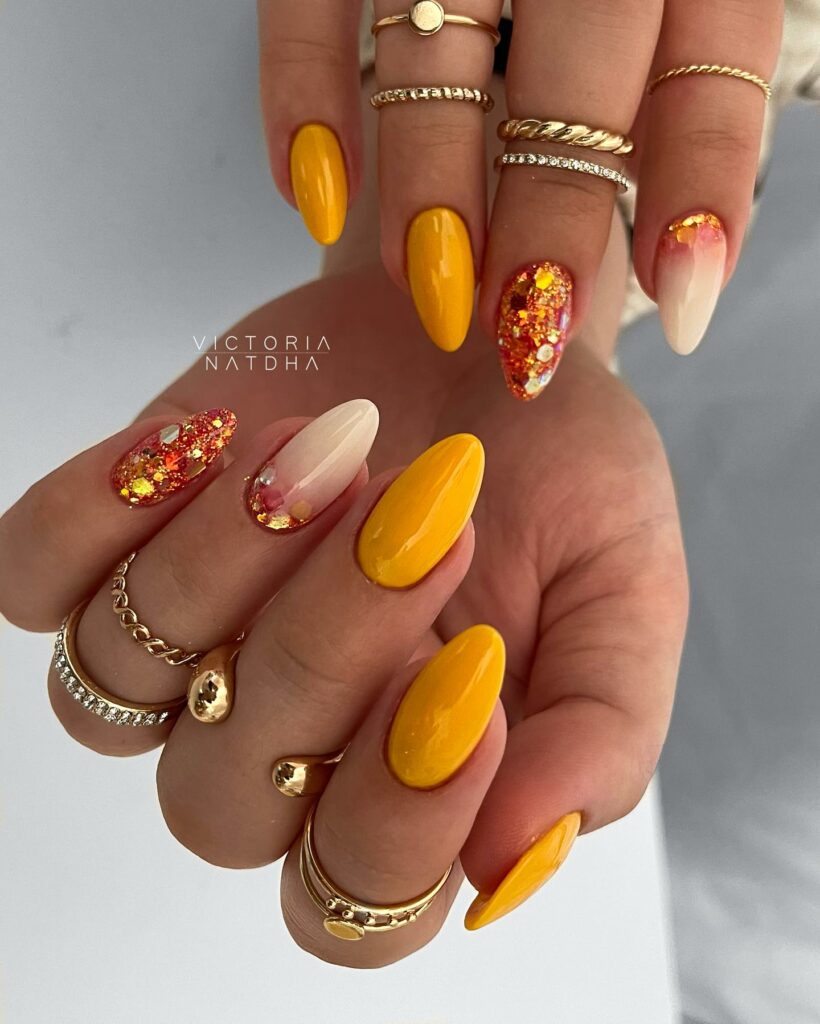 Glitter Accents and Bold Yellow Nails