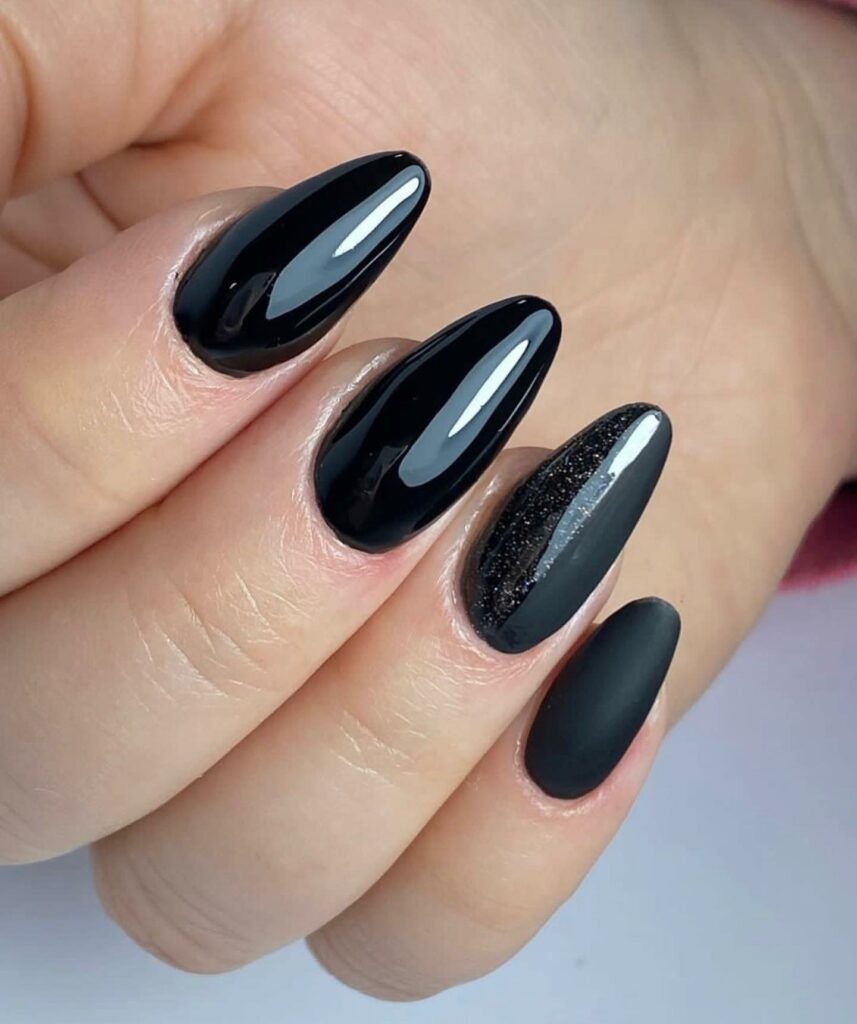 Sleek and Shiny Black Almond Nails
