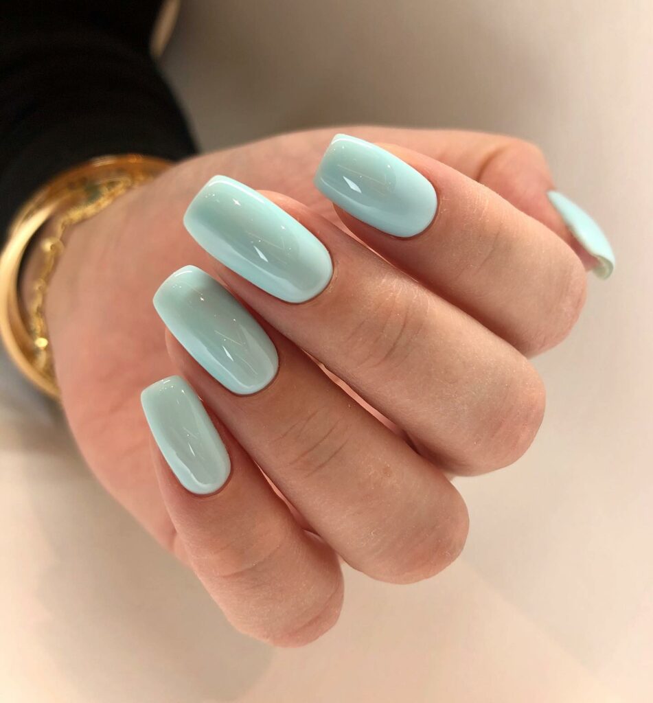 Lustrous Finish with Glossy Mint Green Nails
