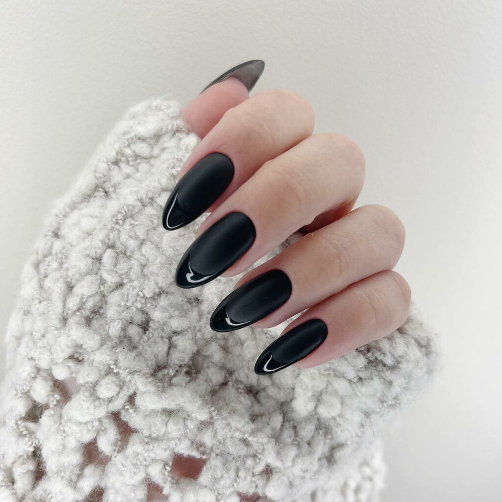 Matte Black Almond Nails with a Velvety Finish
