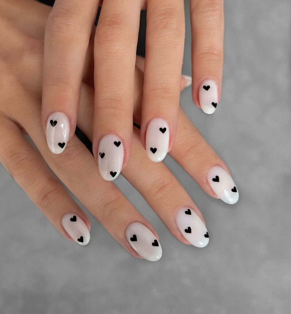 Round White Nails with Adorable Black Hearts