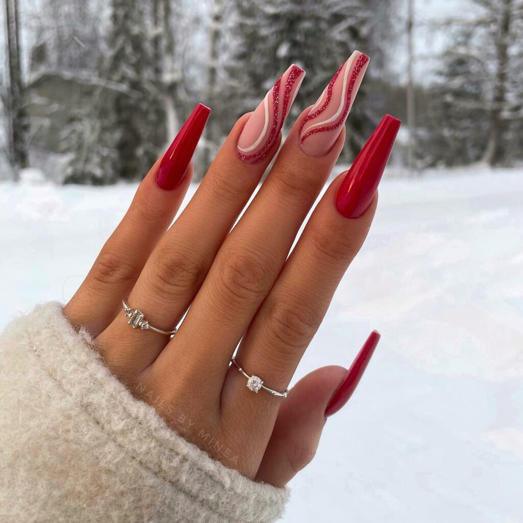 Ruby Reds with Snowy Swirls on Pink Nails