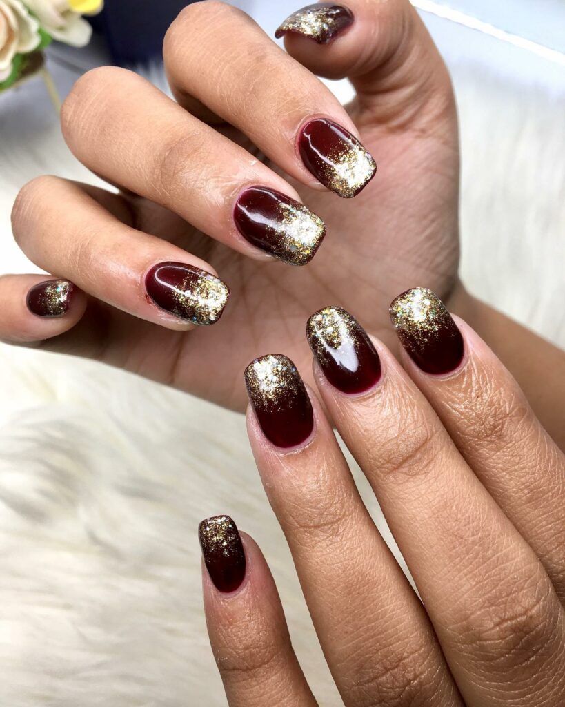 Short Burgundy Nails with Gold Accents