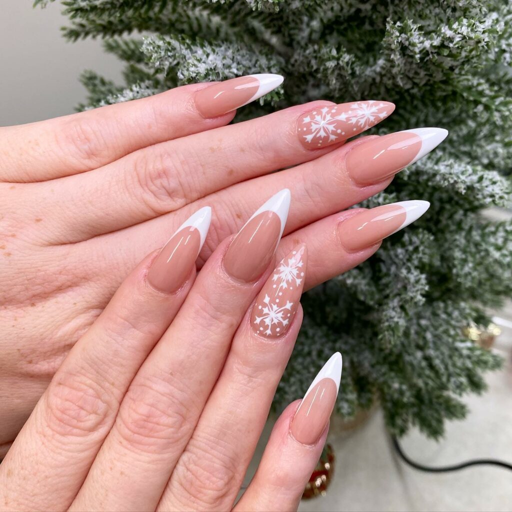 French Manicure with Snowflake Silhouettes
