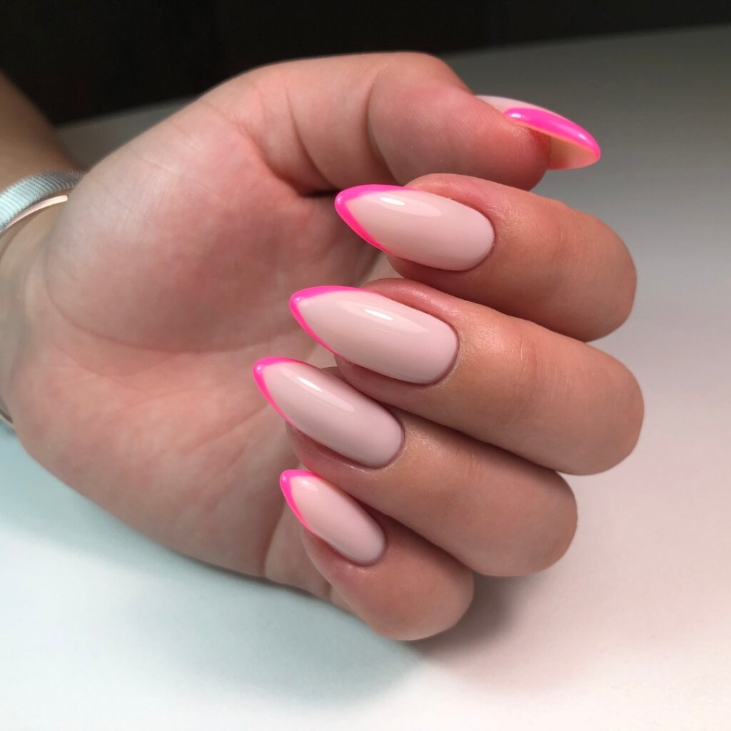 Stiletto Light Pink Nails with a French Hot Pink Tip