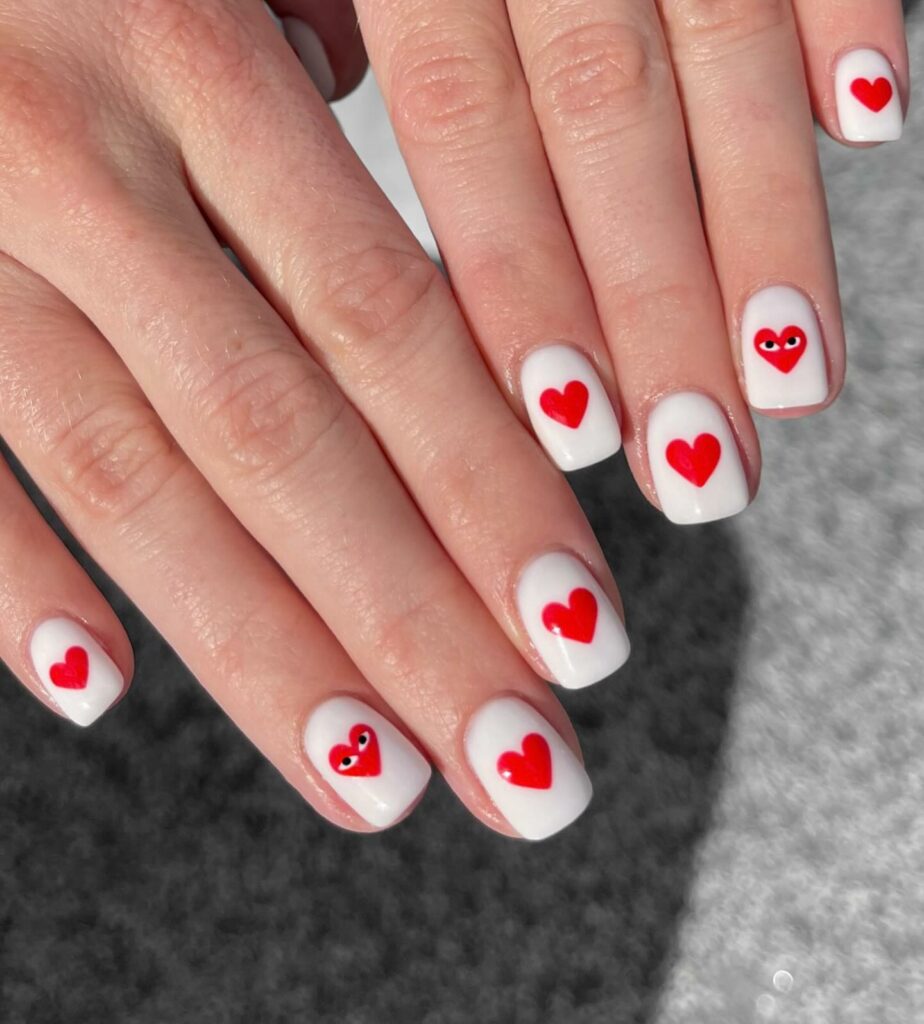 White Nails with Playful Red Hearts