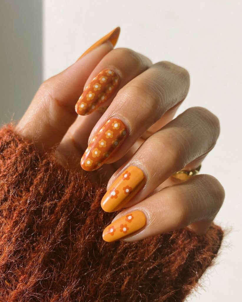 Fall-Inspired 70s Nails With Daisy Design