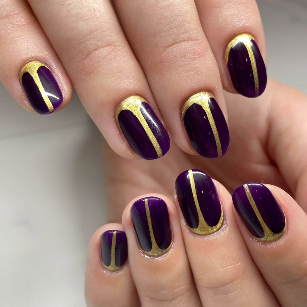 Short Dark Purple Nails With Gold Line Design