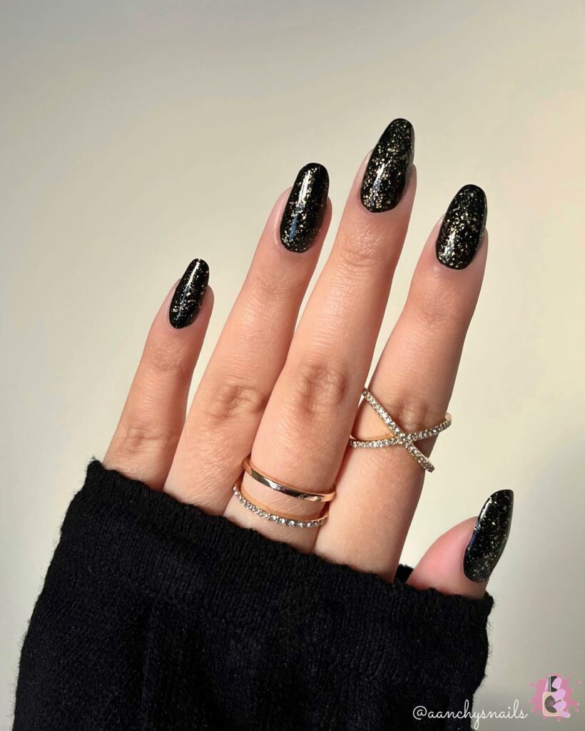 Black Almond Nails With Gold Glitter