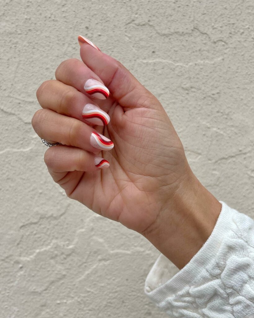 Simple White And Red 70s Swirl Nails