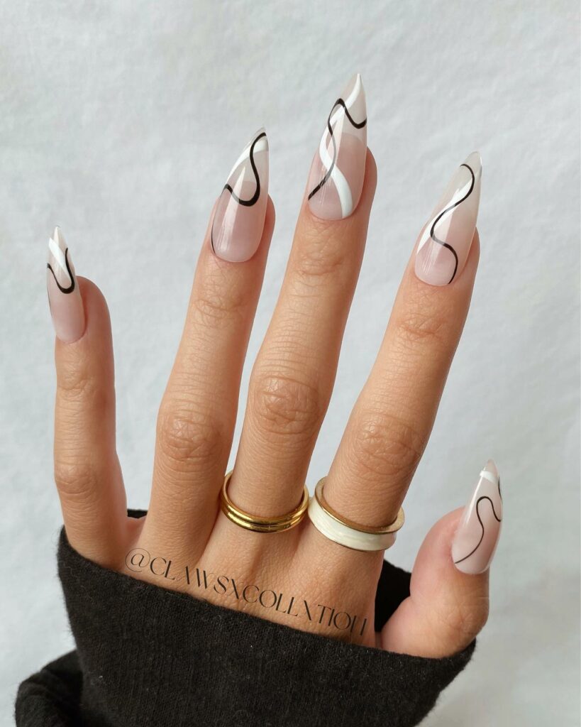 Negative Space Nails Stiletto Nails With Black And White Swirl Design