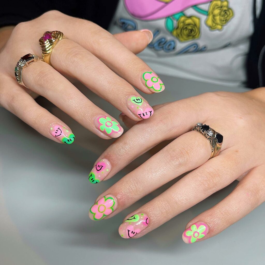 Pink And Green Nails With Emoji And Flower Design