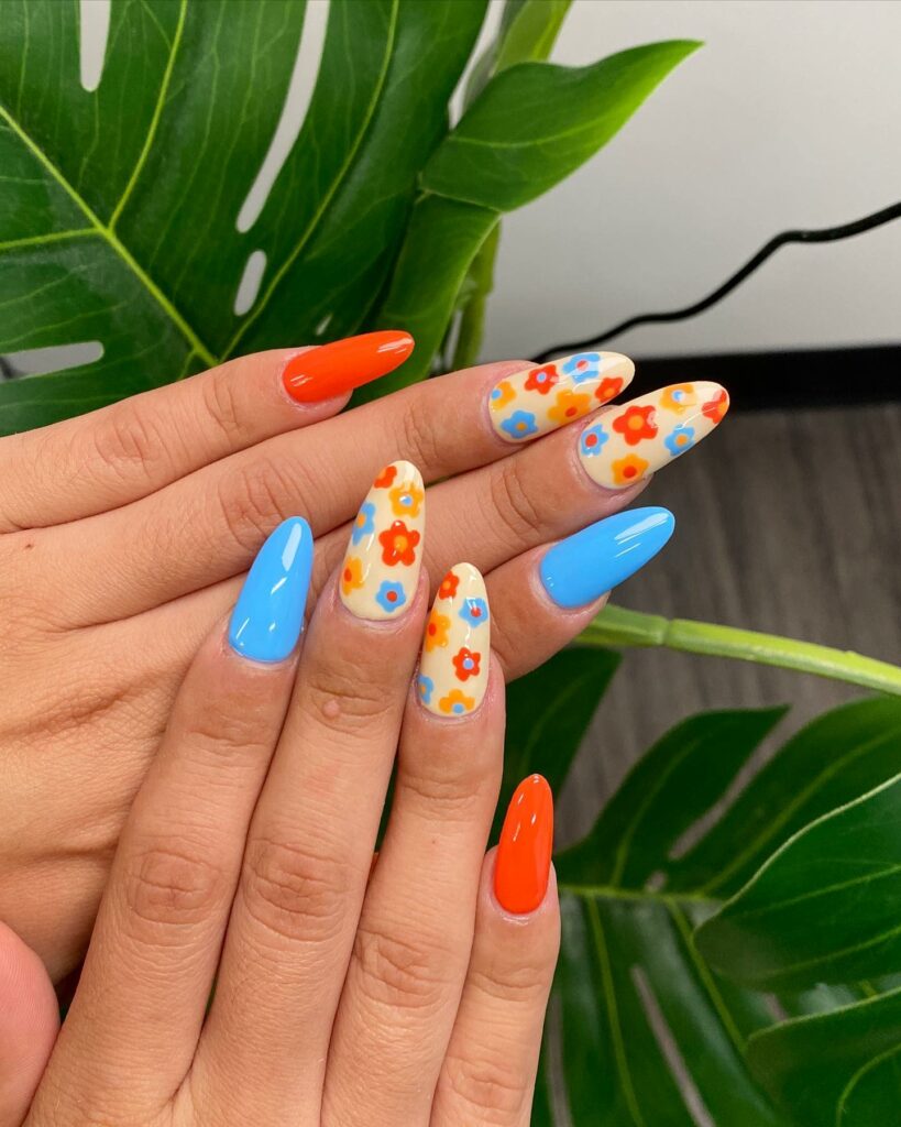 Orange And Blue Nails With Daisies Design
