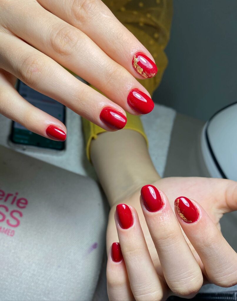 Short Red Nails With Gold Flakes