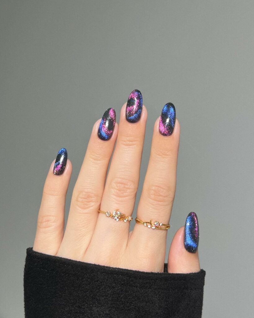 Black Nails With Pink And Blue Glitter