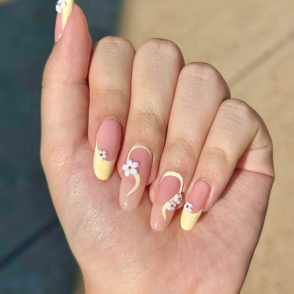 Yellow French Nails With Swirl And Flower Design