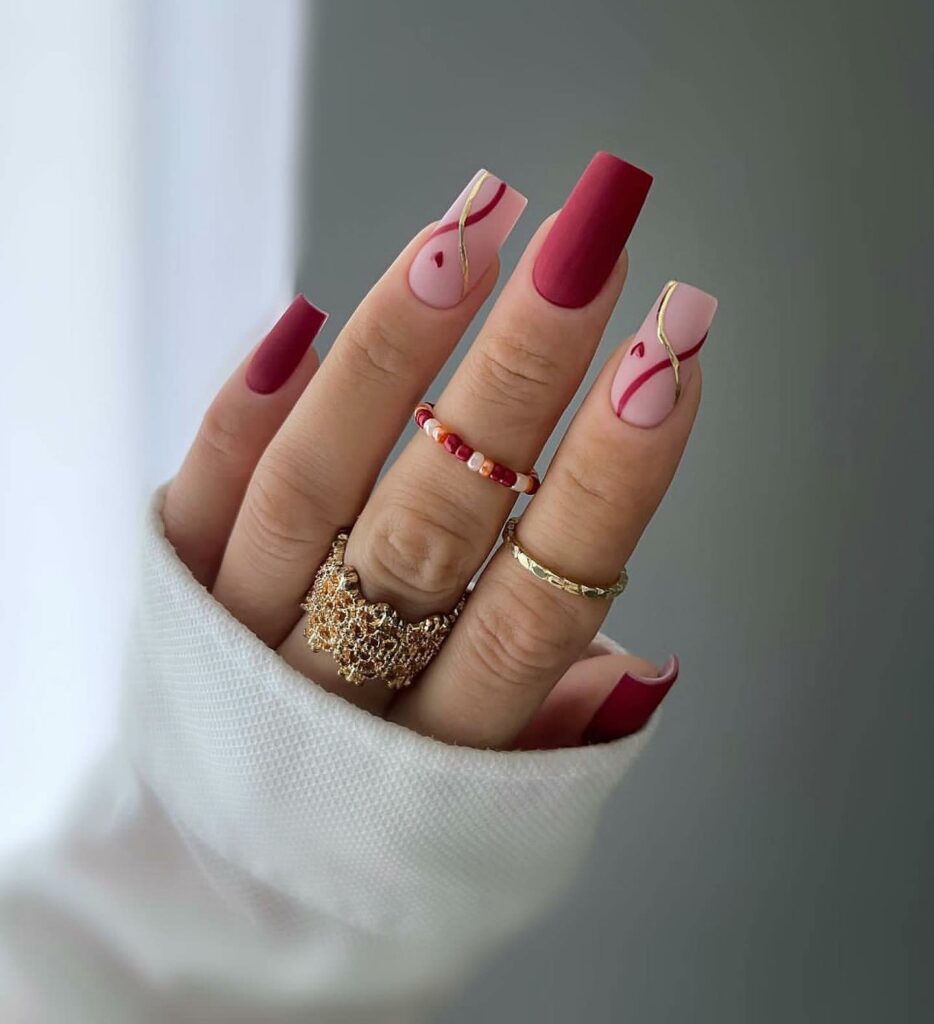 Red Matte Nails With Gold Swirl