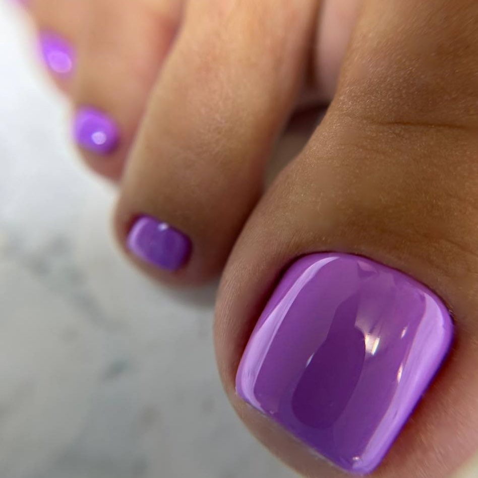 Sleek Glossy Purple Pedicure