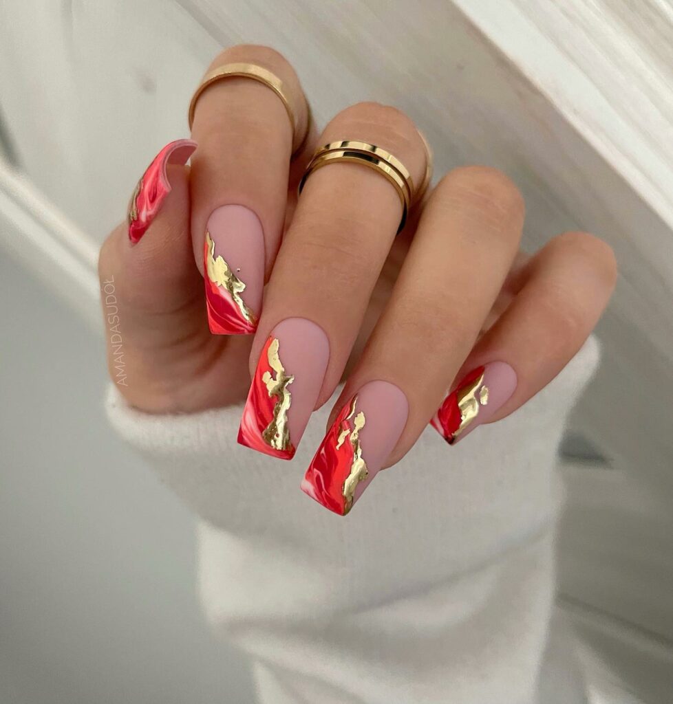 Marble Elegance with Red and Gold Christmas Nails