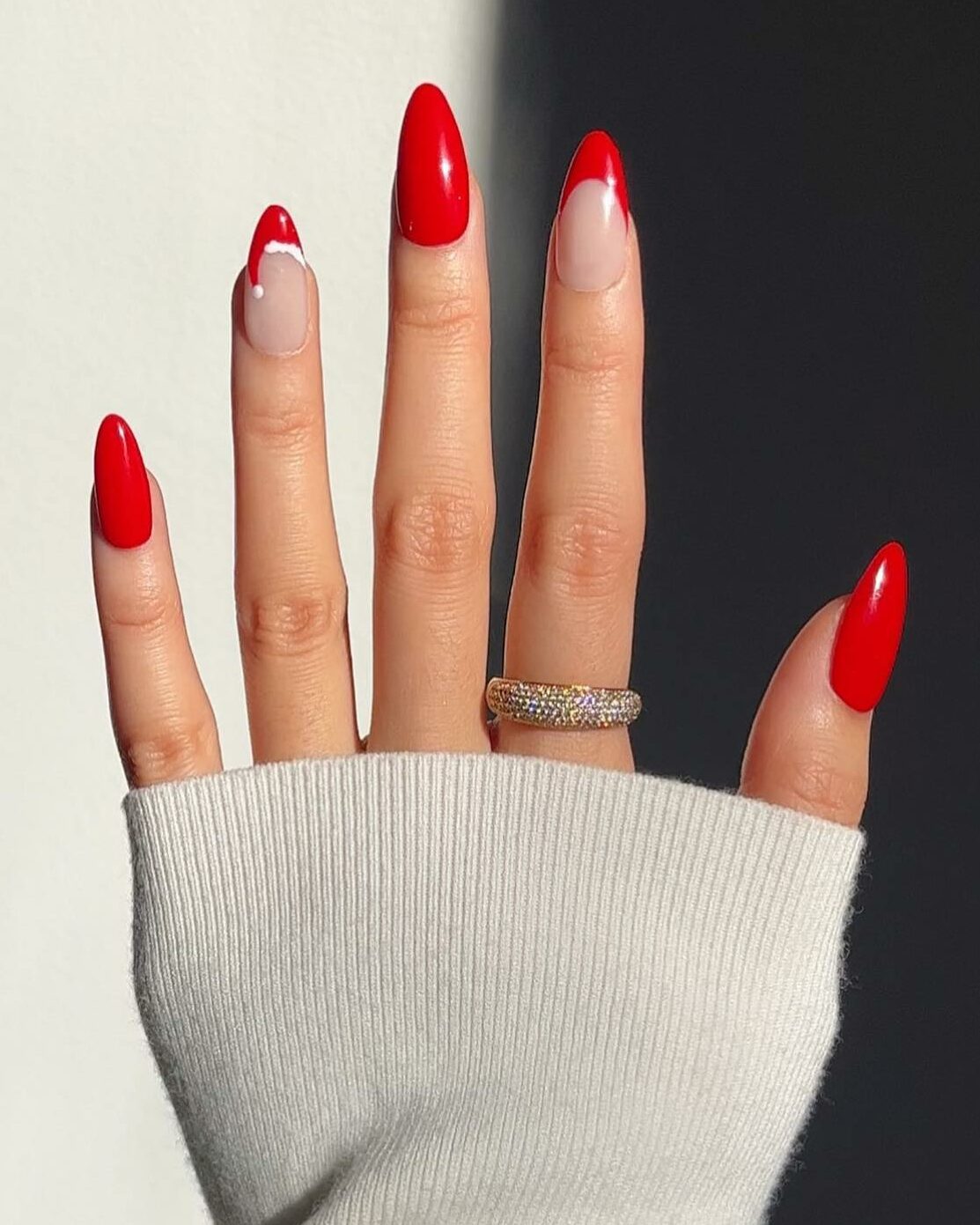 Red Nails with a Playful Santa Hat Design