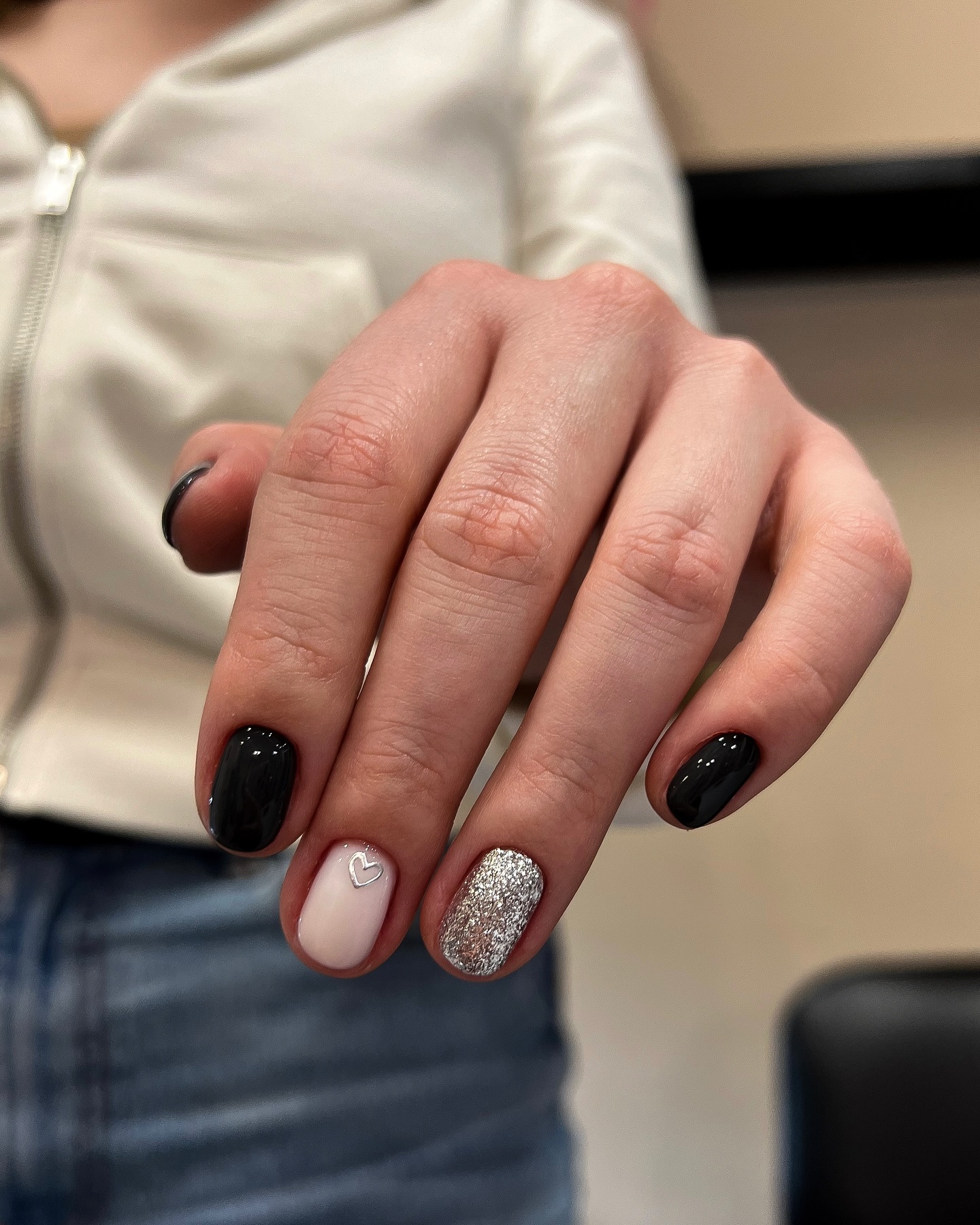 Chic Black and Silver Nail Design with Heart Detail