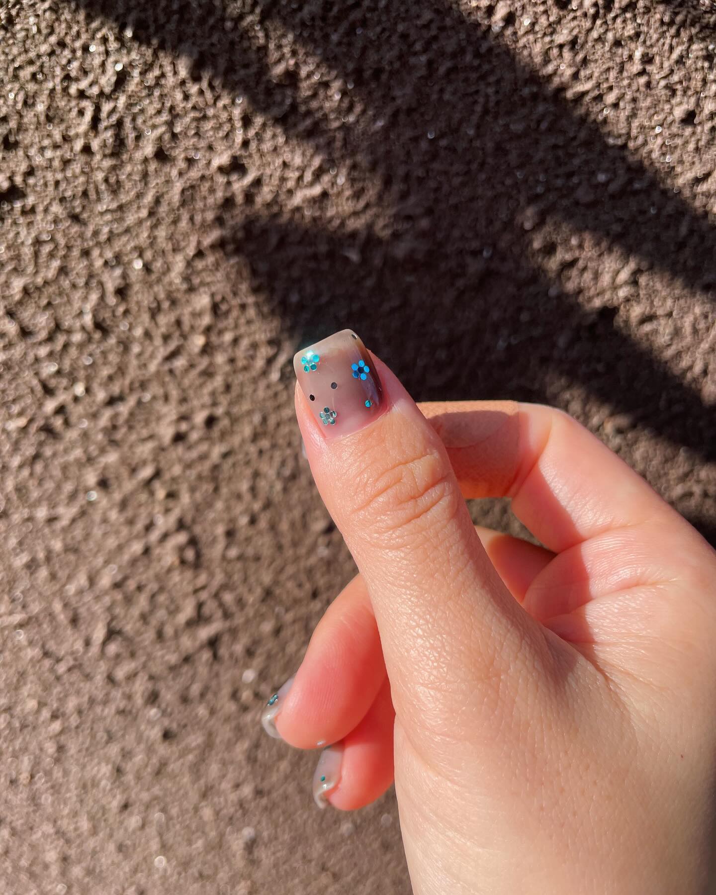 Chic Clear Nails with Blue Glitter Flowers