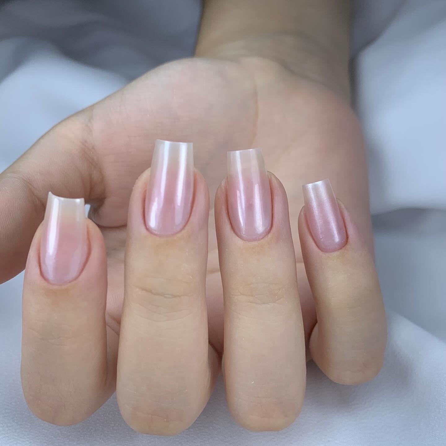 Chic French Manicure with a Glossy Coffin Shape