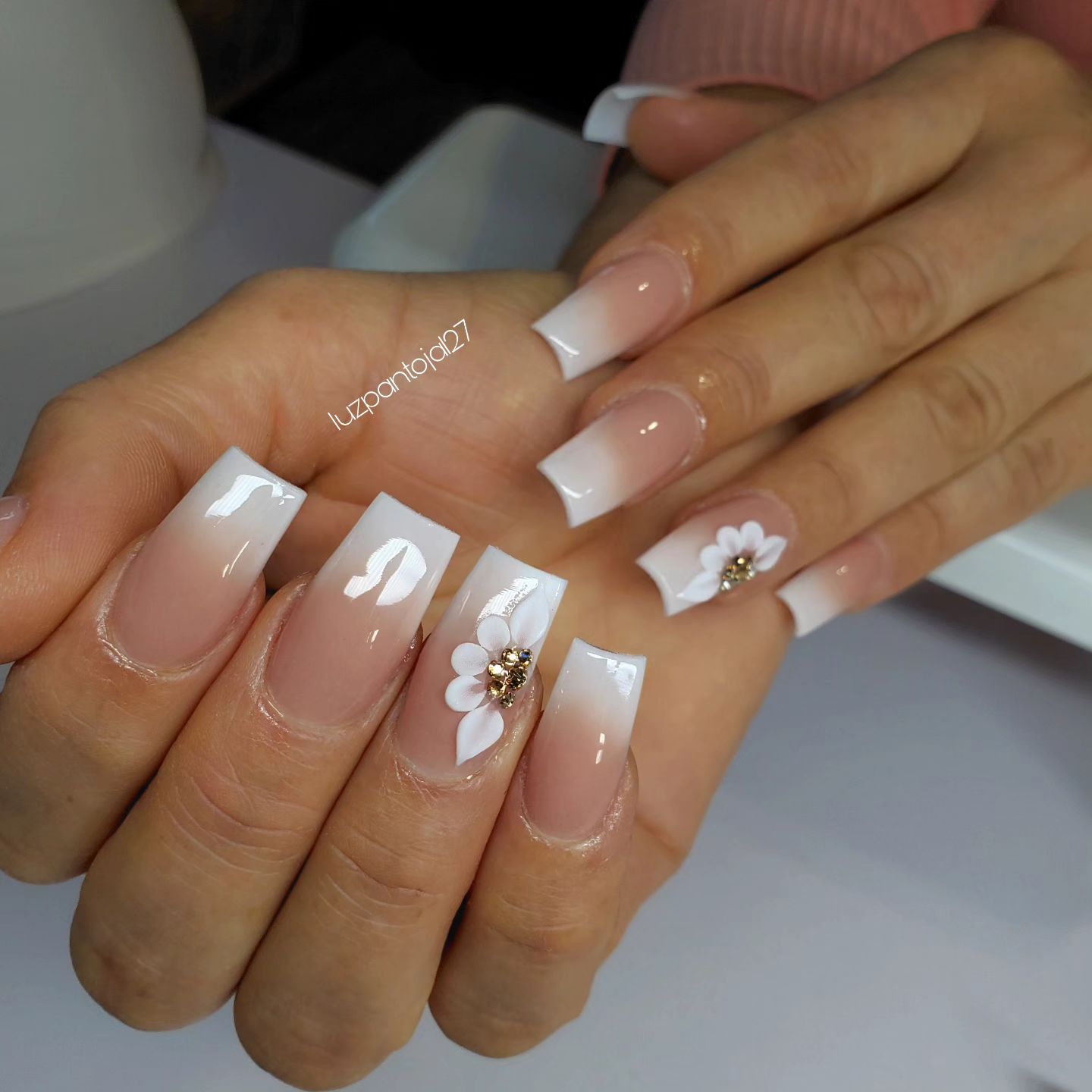 Elegant Ombre French Manicure with Floral Accents