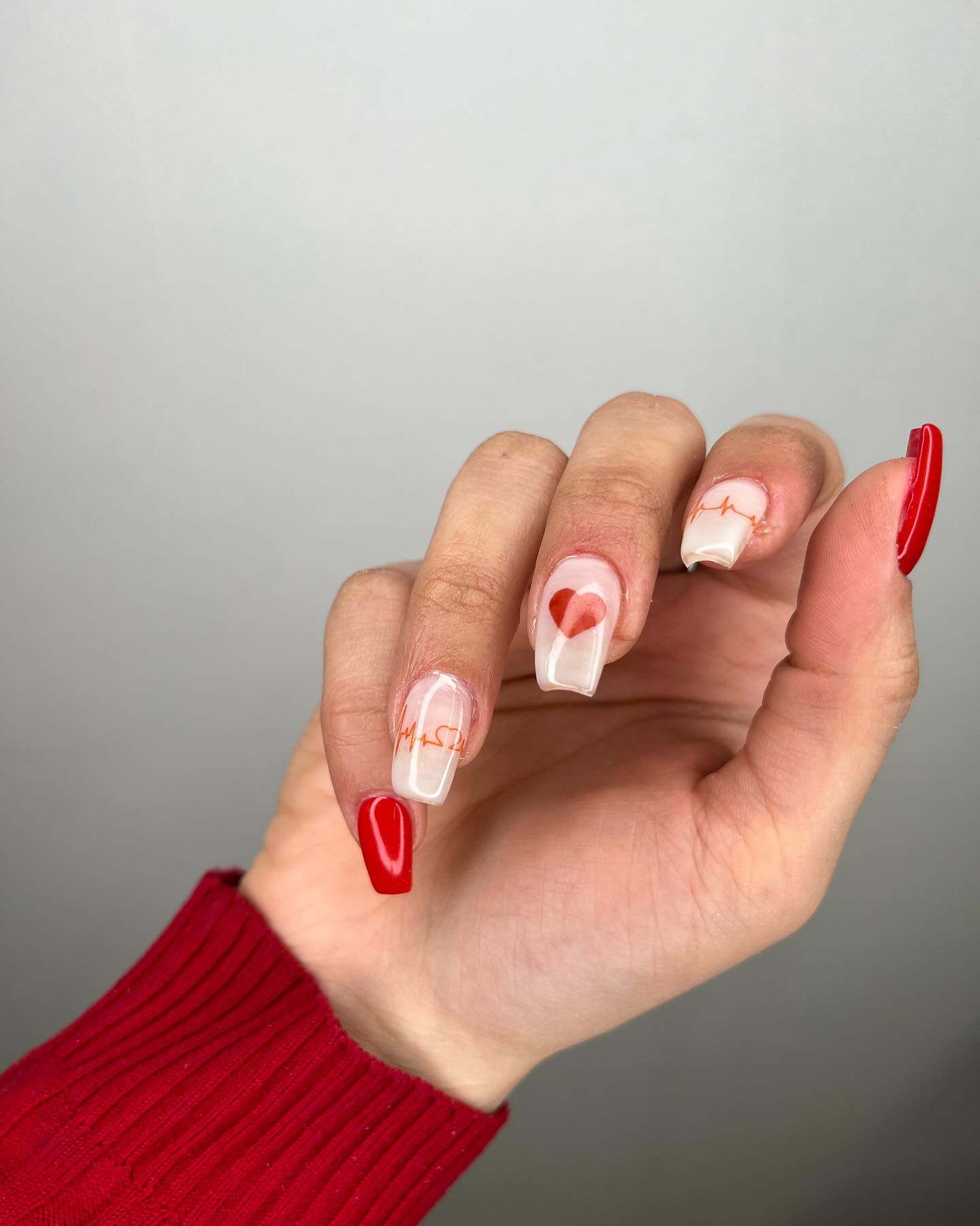 Elegant Red and Translucent Nails with Gold Flakes