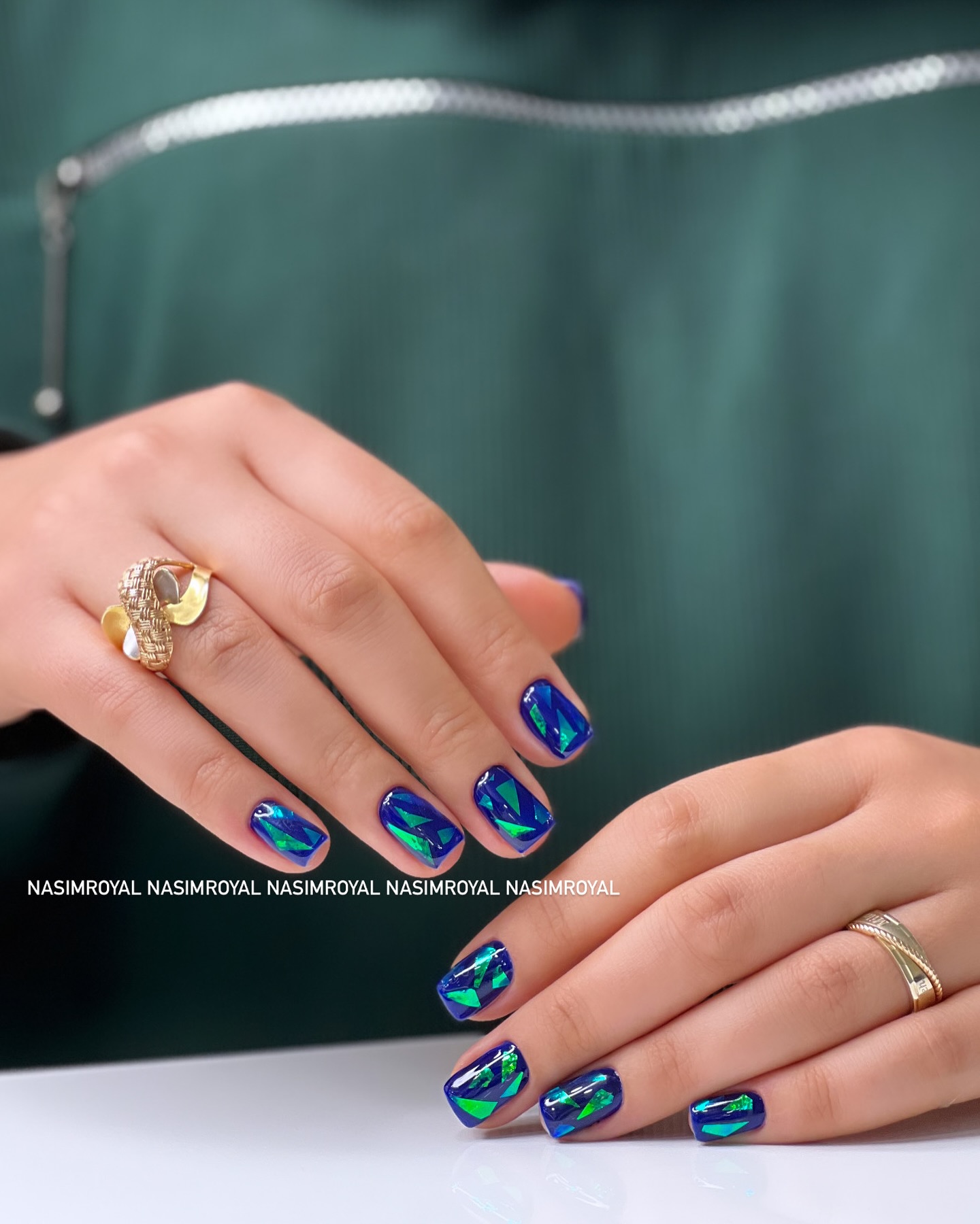 Iridescent Blue-Green Geometric Almond Nails