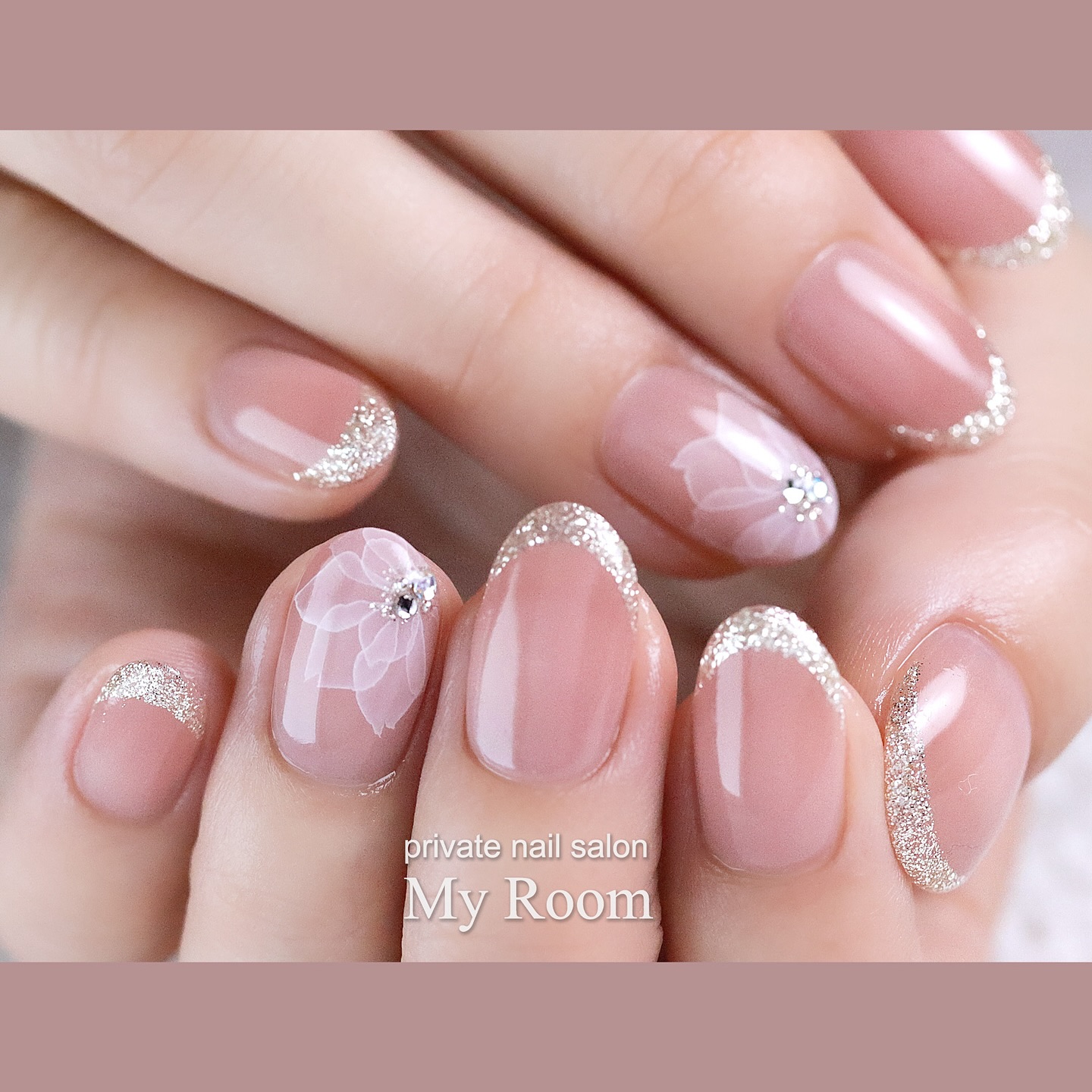 Nude Pink Elegance with Glitter French Tips & Floral Accents