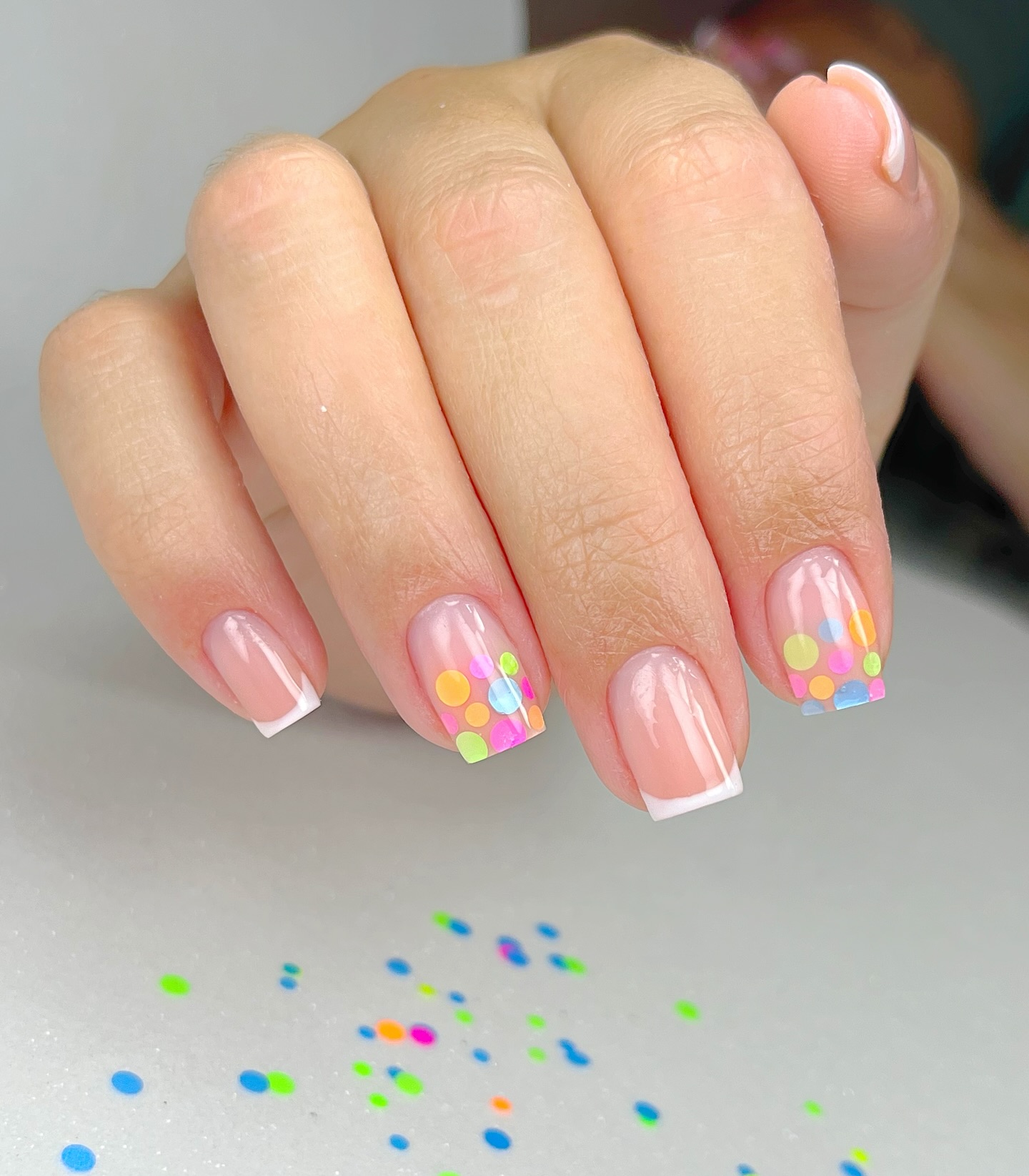 Playful French Manicure with Confetti Dots