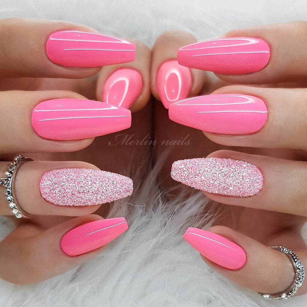Glossy Pink Nail Art with Sparkling Accents