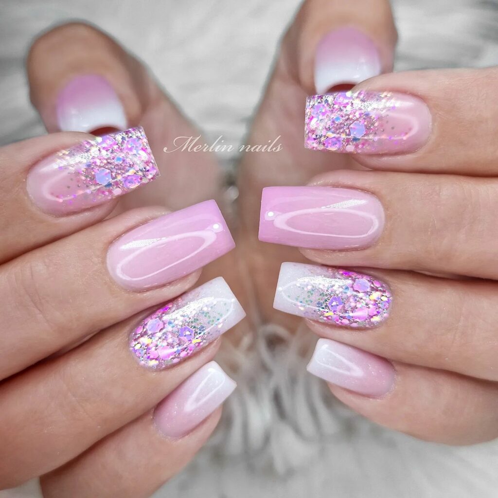 Glossy Pink & White Nail Design with Sparkling Glitter Accents