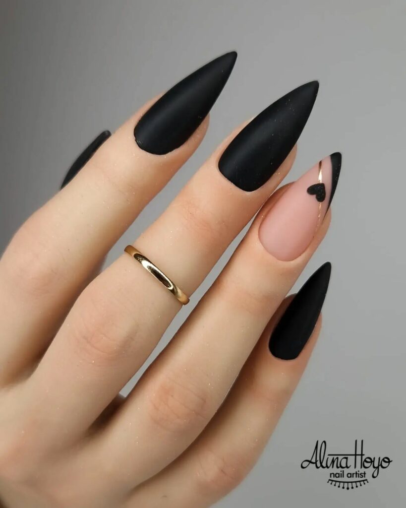 Subtle Elegance: Sleek Stiletto Nails with Black Heart Accent