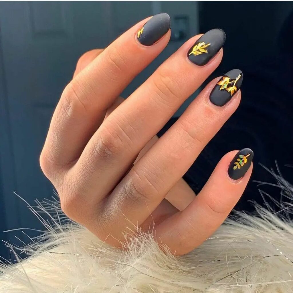 Chic Matt Black Nails with Golden Accents